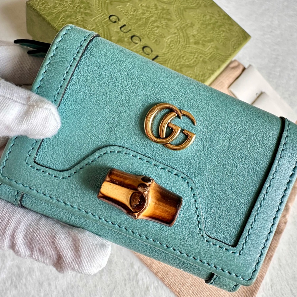 GUCCI 
Wonka Grain Calfskin Diana Tri-Fold Wallet Dusty Azure